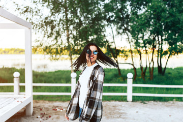 Fototapeta premium Cute laughing girl have fun outdoor in the park