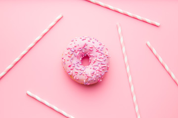 Pink donut and pink straws.
