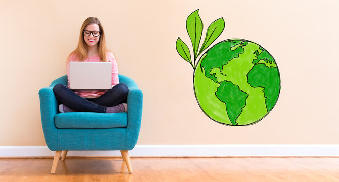Green Earth with young woman using her laptop in a chair
