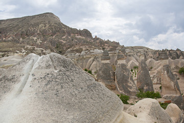 Fairy chimneys in Cappadocia . The fairy chimney is a product of its many environments, a miracle millions of years in the making.