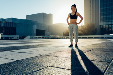 Woman standing outdoors before demonstrating trick techniques