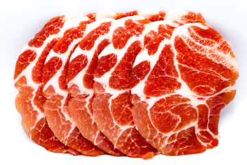 Close-up sliced raw pork isolated on white background. It copy space and selection focus.