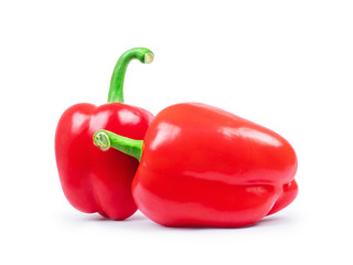 Two red peppers closeup isolated on white background