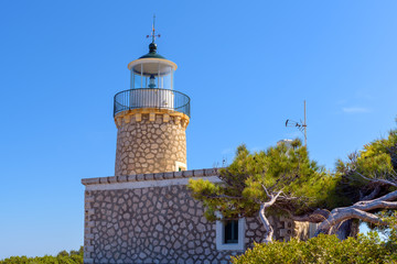 Fototapeta na wymiar Lighthouse of Keri located at the Marathias cape on Zakynthos island in Greece. The height of the tower is 9 meters.