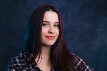 Young pretty smiling positive woman with healthy skin and hair studio shoot, copy space