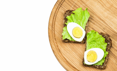 sandwiches on a wooden board
