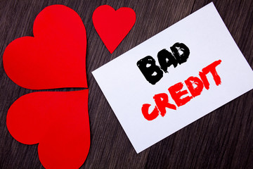 Writing text showing  Bad Credit. Concept meaning Poor Bank Rating Score For Loan Finance written on notobook paper note on the wooden background with Love Heart.