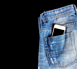 Blue, worn jeans and a phone in the back pocket