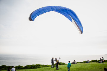 Man opening his paraglider
