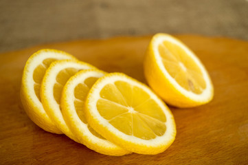 Lemon fruit on dark wood background