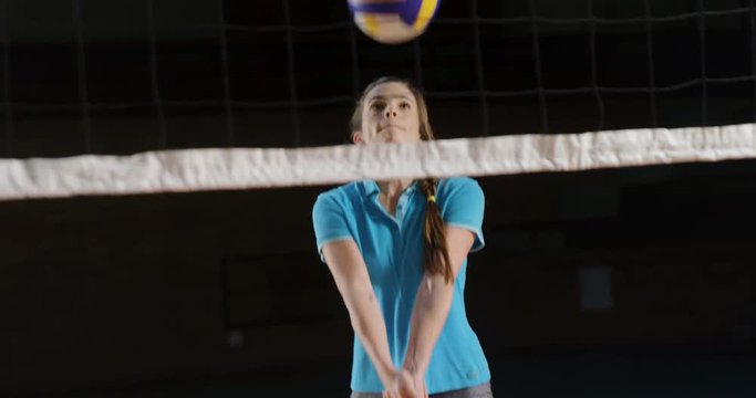 Female player playing volleyball in the court 