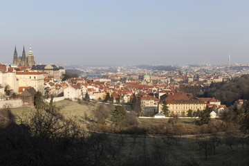 Fototapeta na wymiar Sunny frosty winter Prague City with gothic Castle, Czech Republic