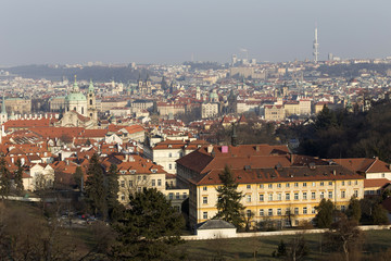 Fototapeta na wymiar Sunny frosty winter Prague City with its Cathedrals, historical Buildings and Towers, Czech Republic