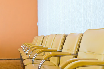 Row of empty chairs in the conference room