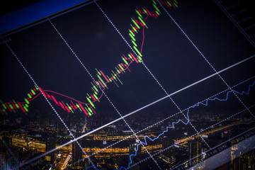 candlestick graph office building background , Business and financial concept