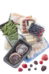 concept of freezing, bunch of frozen food meat, Vegetables, fish, fruits, on a white background