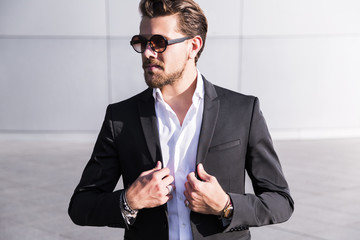 Male businessman or worker in black suit