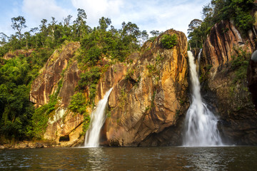 Fototapeta na wymiar Waterfall and cliff beautiful with sunshine