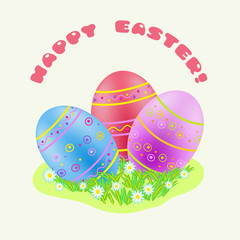 Easter blue; red; purple painted egg in green grass