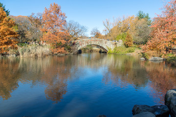 Arched Stone Bridge in Central Park Reflected in Blue Pond, Central Park