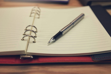 Business and finance concept of office working, Closeup pen on office desk in working day.