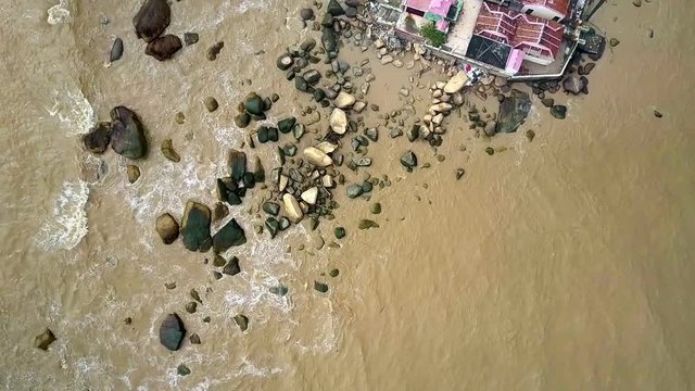 Temple Stands on Shallow Sea Filled with Sand Clay