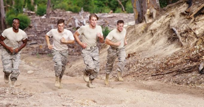 Military soldiers jogging at boot camp 