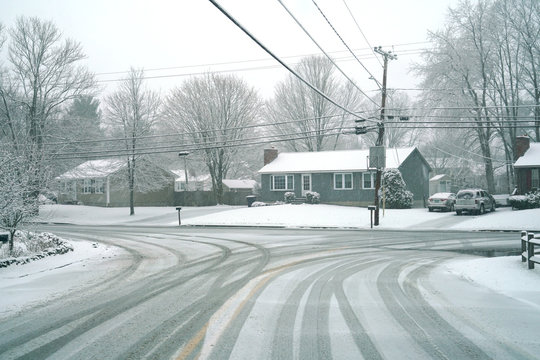 Winter street scene in snow in residential community