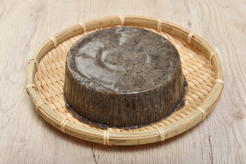 Sesame with lotus seeds rice cake in bamboo basket  
