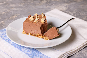 Cold chocolate cheesecake on a white plate