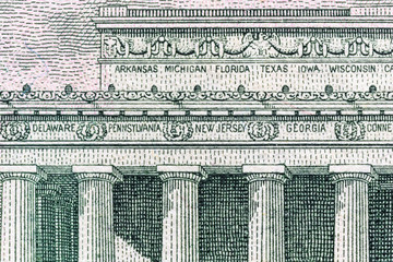 fragment of a banknote five American dollars