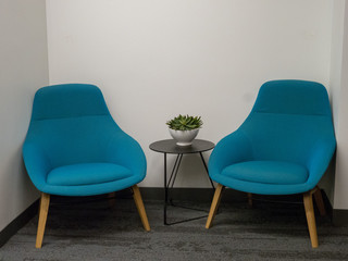 Two chairs in corner nook of office - obrazy, fototapety, plakaty