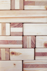 Wood cubes and blocks textured wall background with space for text on blocks.