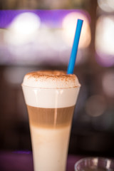 Coffee. Hot coffee. Coffee beans. Wooden table. Blurred background