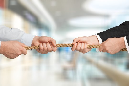 Business Men Hands Holding Rope