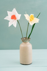 Bouquet of crepe paper daffodil flowers in a vase