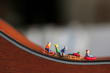 Miniature people : Child  having fun to play slider with acoustic guitar,time of relax or music...