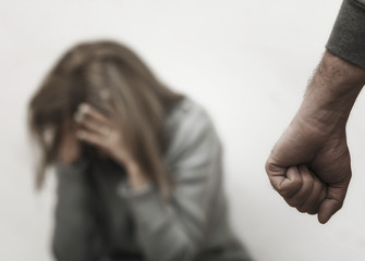 Man beating up his wife illustrating domestic violence