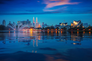 Cityscape of park in the Kuala lumpur city with twin tower background and fountain, Kuala lumpur, Malaysia