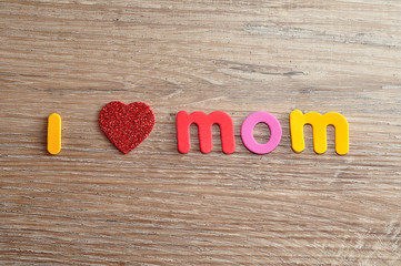 I love mom spelled with colorful letters and a red heart