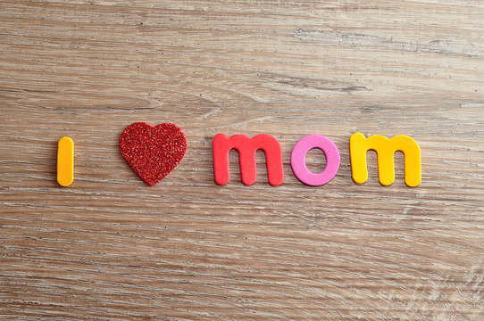 I love mom spelled with colorful letters and a red heart