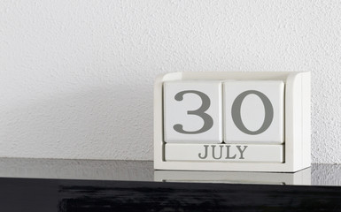 White block calendar present date 30 and month July