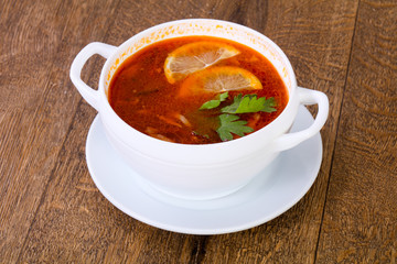 Solyanka soup with lemon
