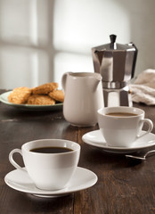 Coffee cups on the wooden table.