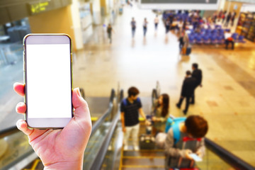 People hand use cellphone at the hall airport background with copy space on screen for using mobile app about activities in the airport or checking flight plan