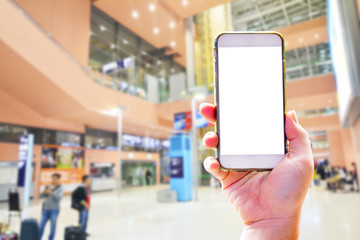 People hand use cellphone at the hall airport background with copy space on screen for using mobile app about activities in the airport or checking flight plan