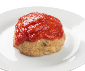 meatball with red sauce on a plate, white background