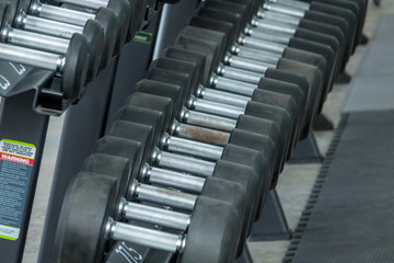 Naklejka na ściany i meble Fitness equipment in sport gym club. Close-up shot.