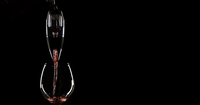 Pouring red wine and aerator