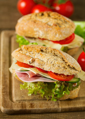 Wholegrain Ciabatta Sandwich with Lettuce, Tomatoes, Ham and Cheese